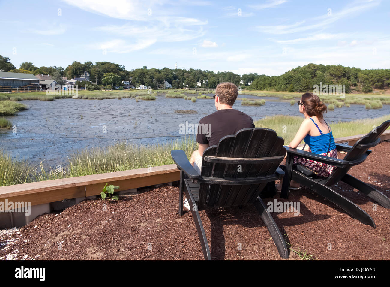 Couple viewing scenic low tide at Duck Creek in Wellfleet, Massachusetts, United States. Stock Photo