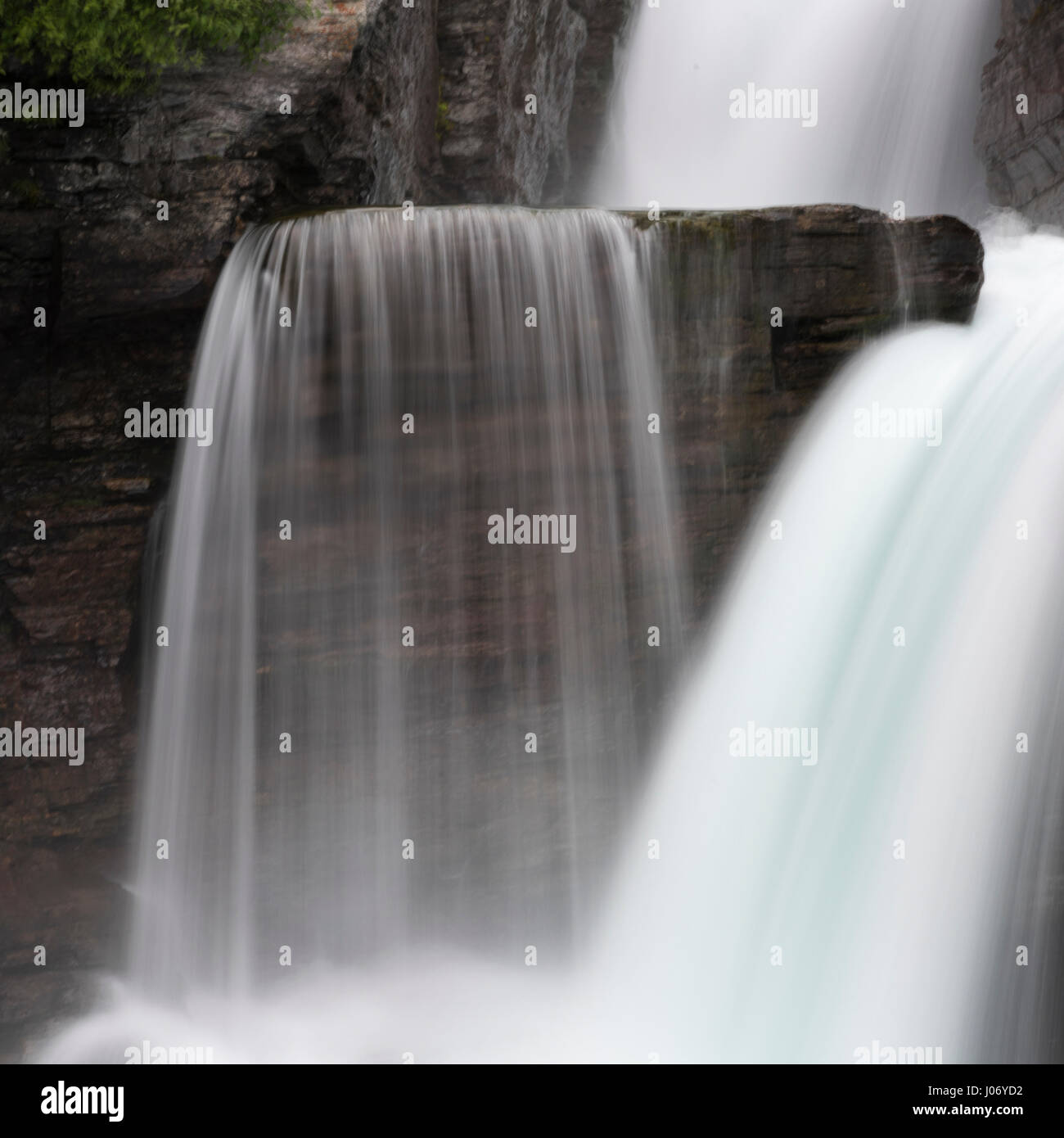 Water falling from rocks in a forest, St Mary Falls, Glacier National Park, Glacier County, Montana, USA Stock Photo