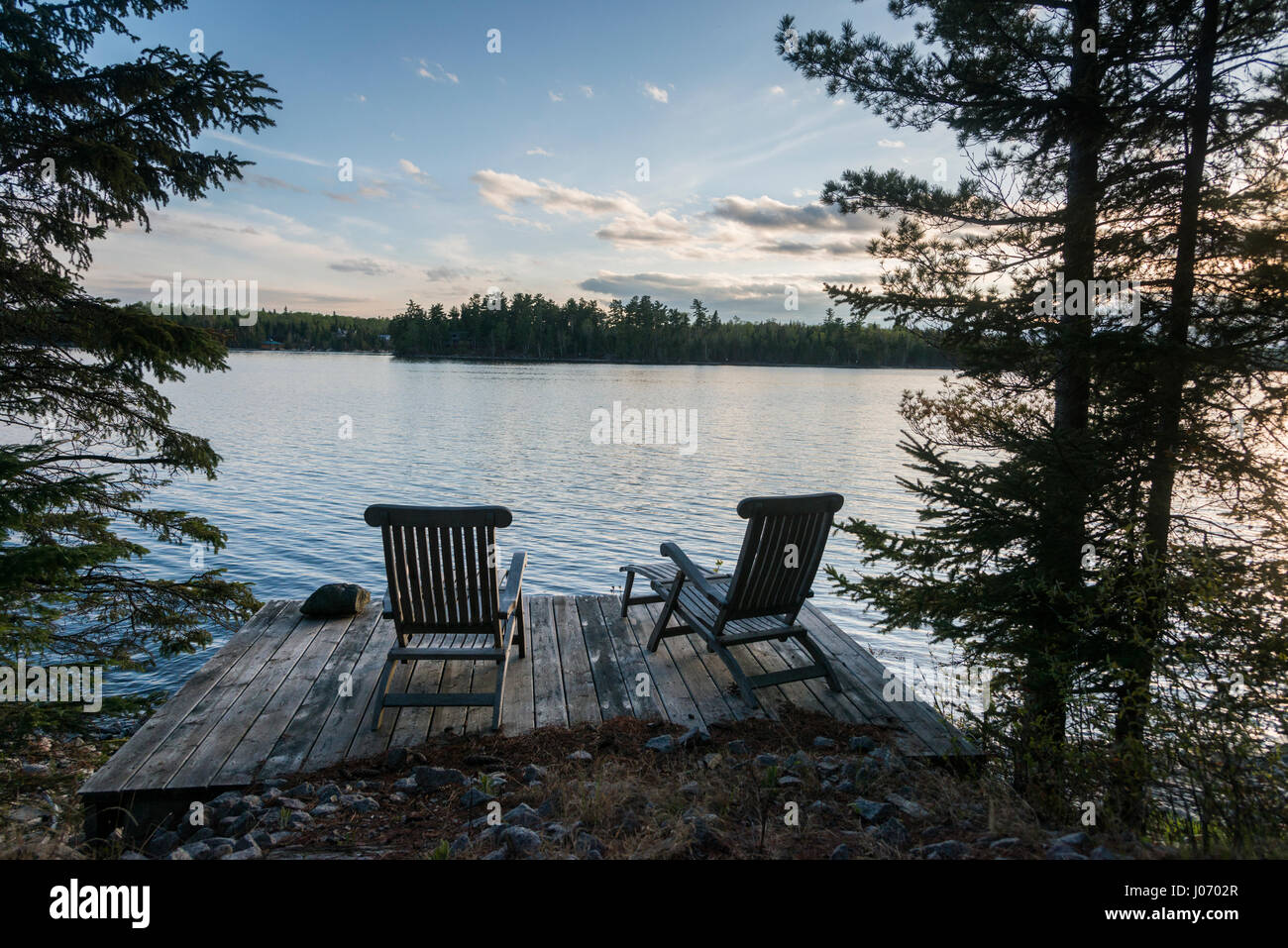 Chairs on a deck, Lake of the Woods, Ontario, Canada Stock Photo - Alamy
