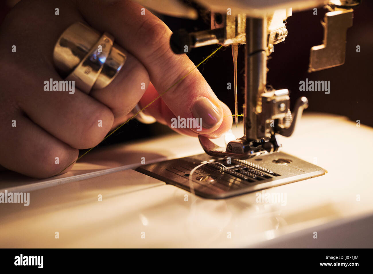Thread holding needle hi-res stock photography and images - Alamy
