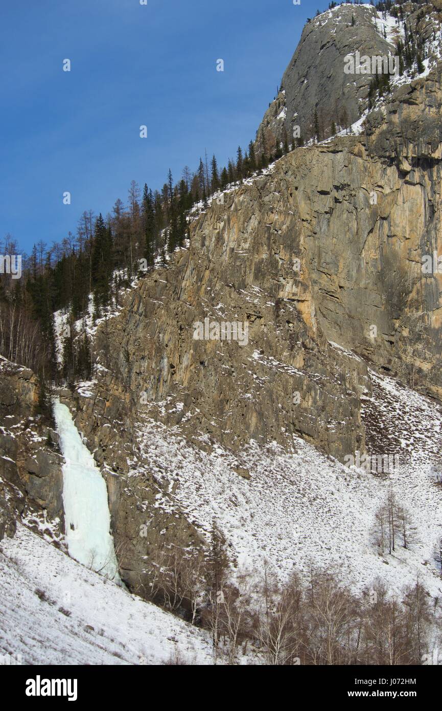 Frozen waterfall in winter time in the mountains Stock Photo