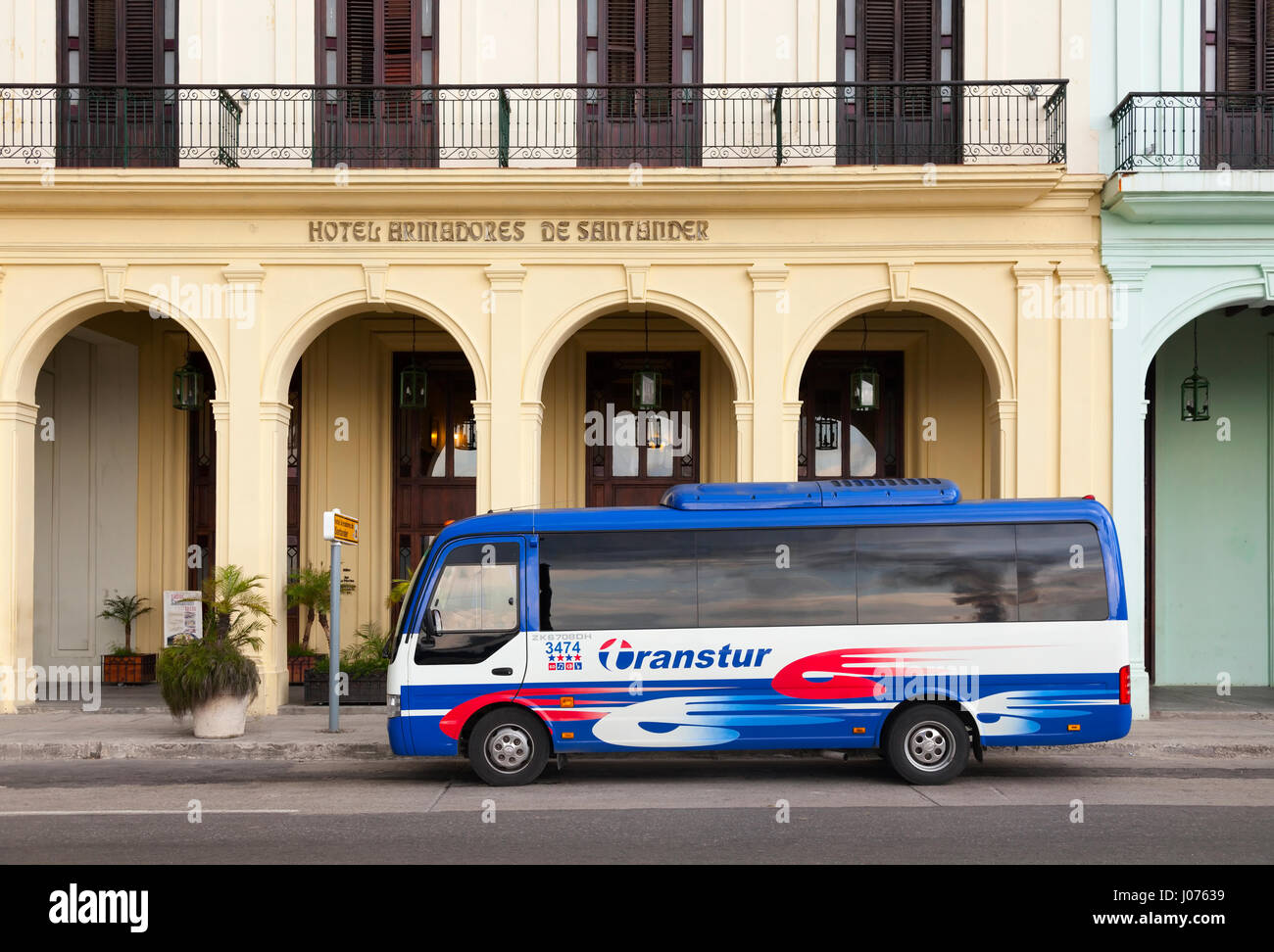 A Transtur bus in front of the Hotel Armadores de Santander along the Malecon in Old Havana, Cuba. Stock Photo