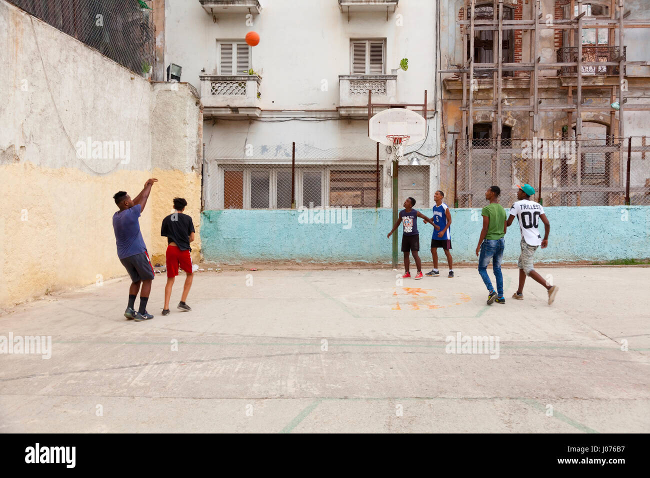 Young Cubans playing basketball in Old Havana, Cuba. Stock Photo
