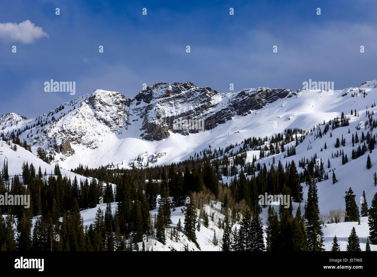This is a view of a snow-covered mountain known as Devil's Castle located in the Albion Basin area of Alta, Utah, USA. Stock Photo