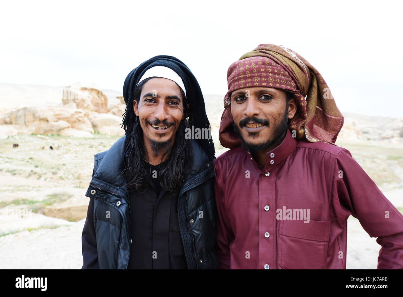 Young Bedouin men wearing a traditional eyeliner called Kohel. Stock Photo