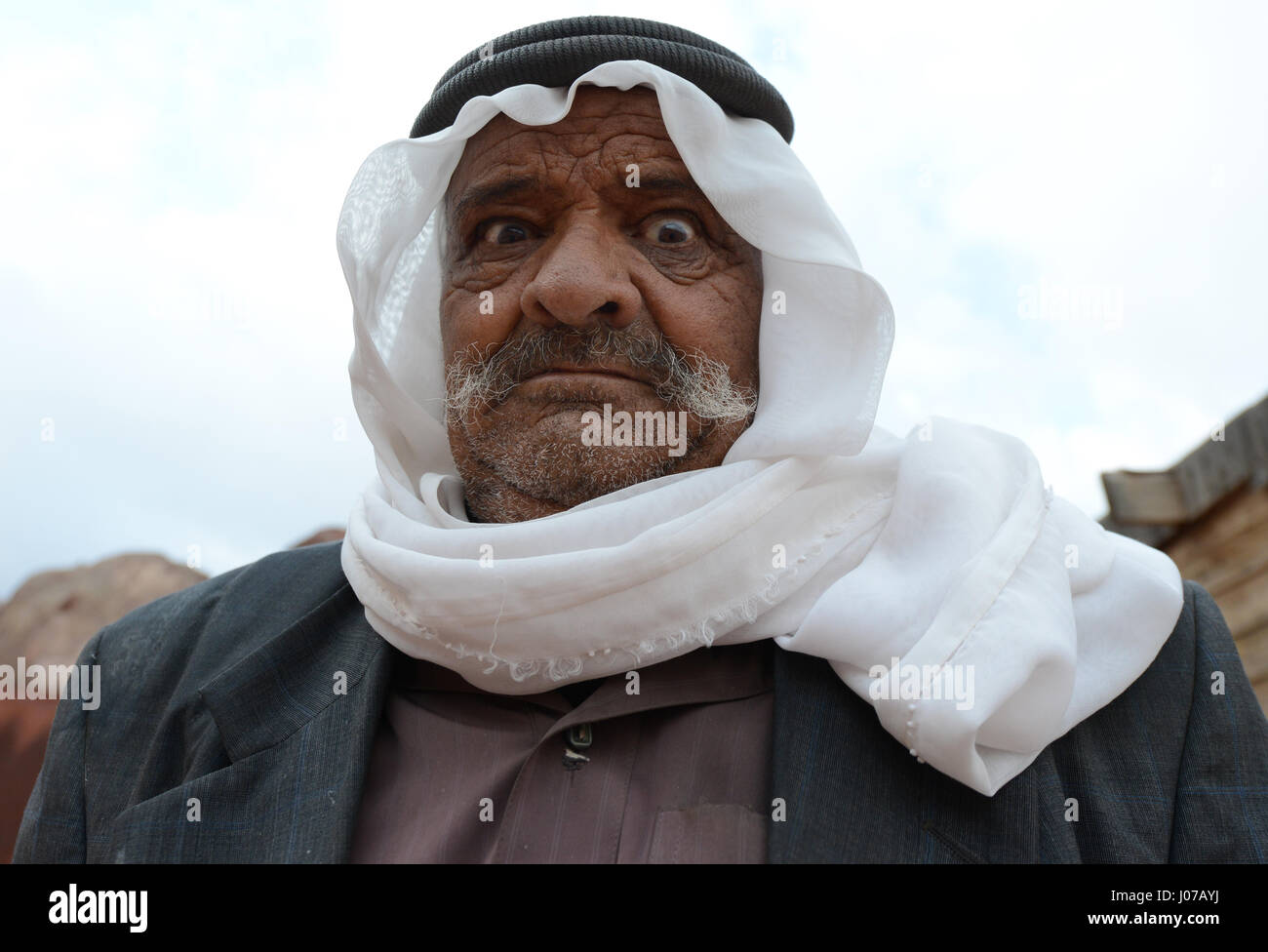 Portrait of a Bedouin man making funny faces Stock Photo - Alamy Portrait of a Bedouin man making funny faces Stock Photo - Alamy