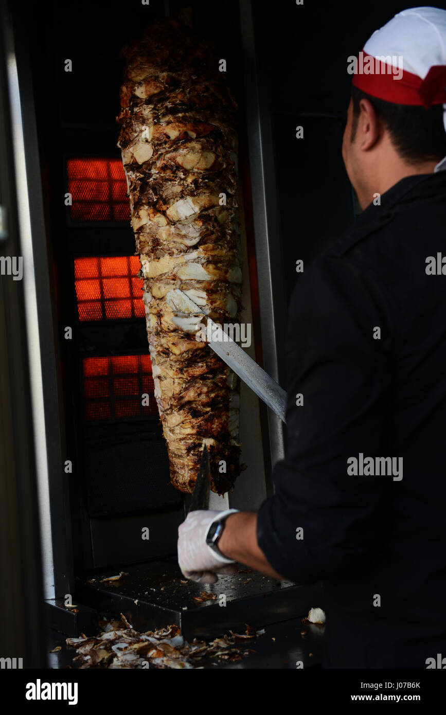 Cutting Shawarma in a popular restaurant in Aqaba, Jordan. Stock Photo