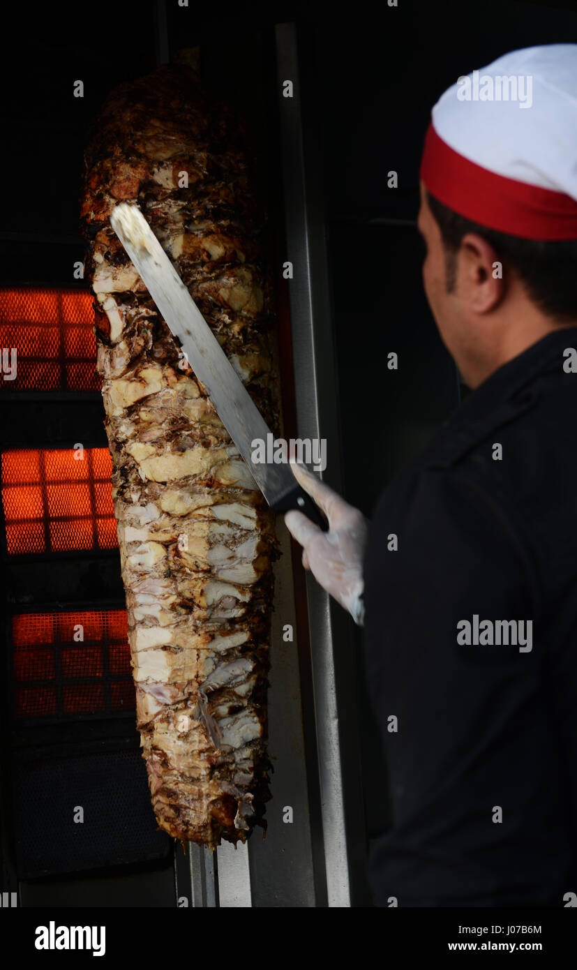 Cutting Shawarma in a popular restaurant in Aqaba, Jordan Stock Photo