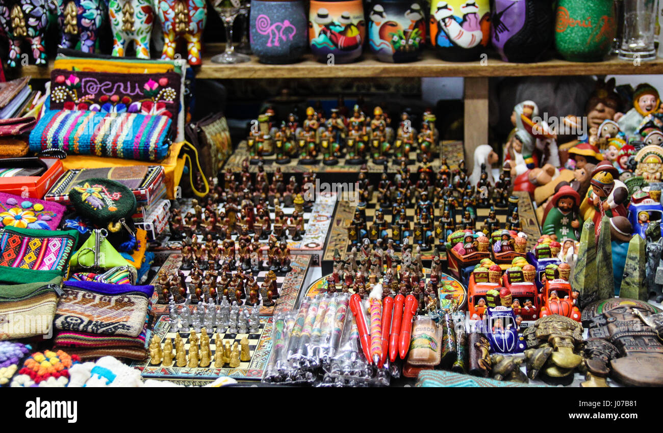 At the markets in Aguas Calientes, colourful souvenirs and interesting chess pieces on display to take home after visiting Machu Picchu in Peru. Stock Photo