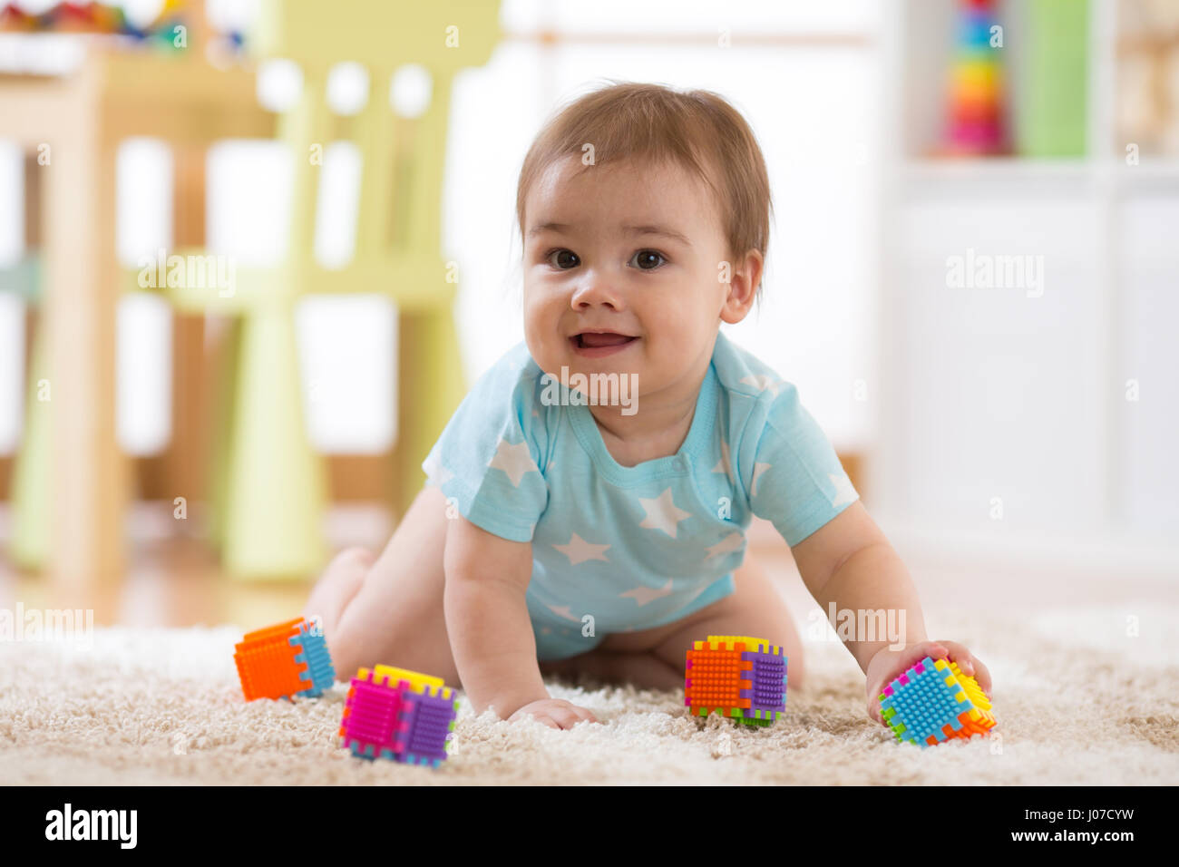 crawling funny baby boy indoors at home Stock Photo