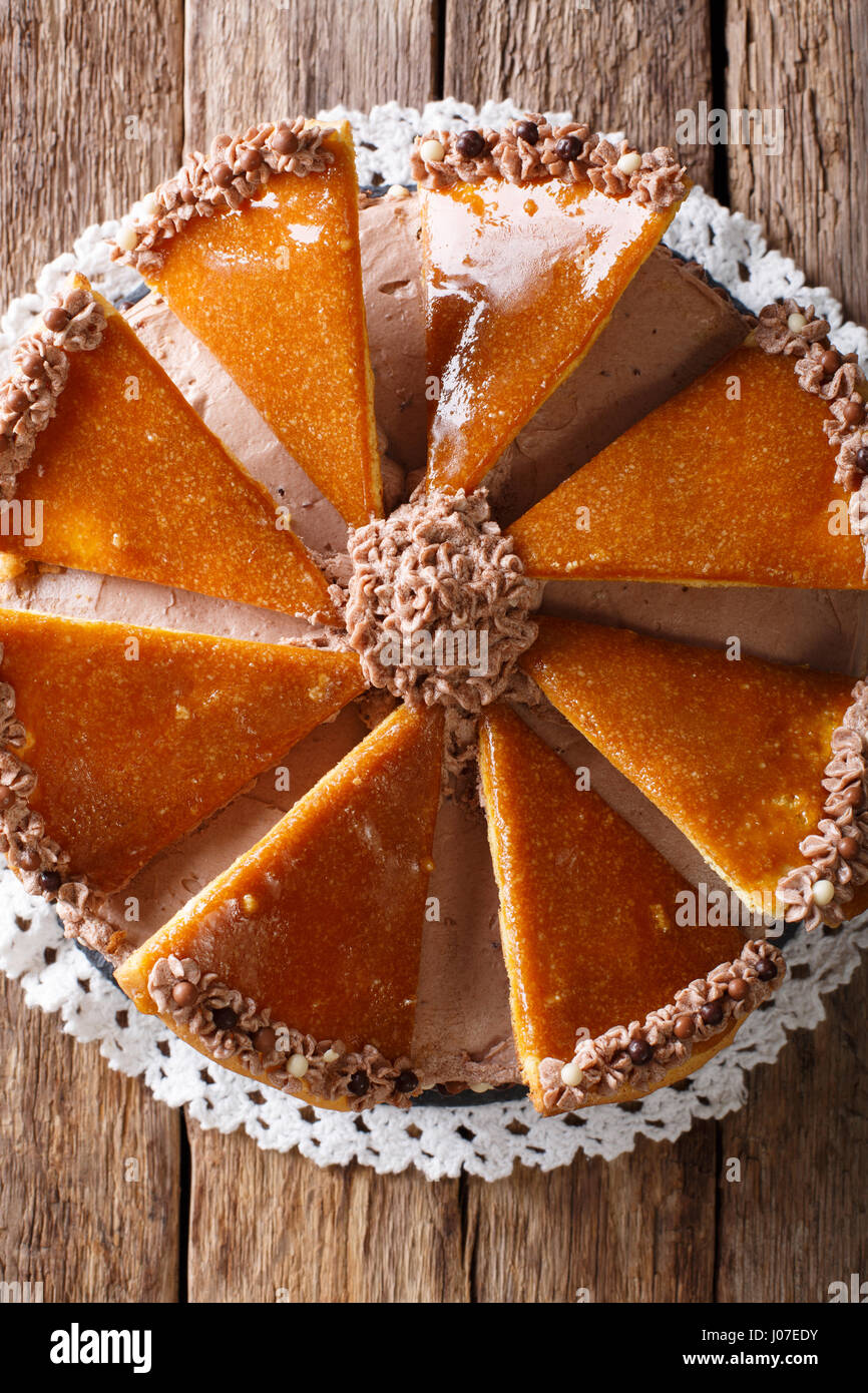Traditional Hungarian Dobosh cake with caramel decoration macro on a plate. Vertical view from above Stock Photo
