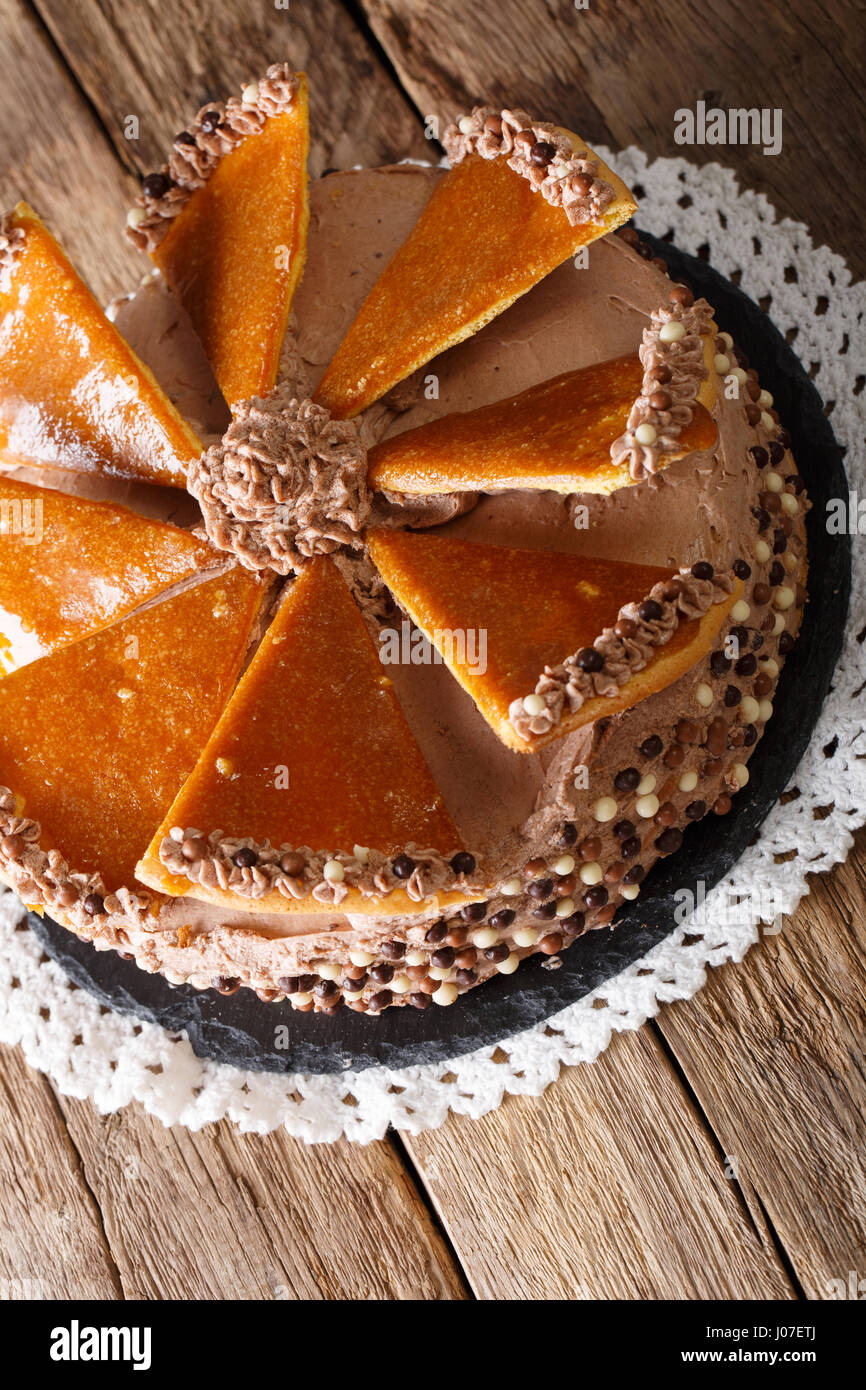 Hungarian Dobosh cake with caramel and butter cream close-up on a plate. vertical Stock Photo
