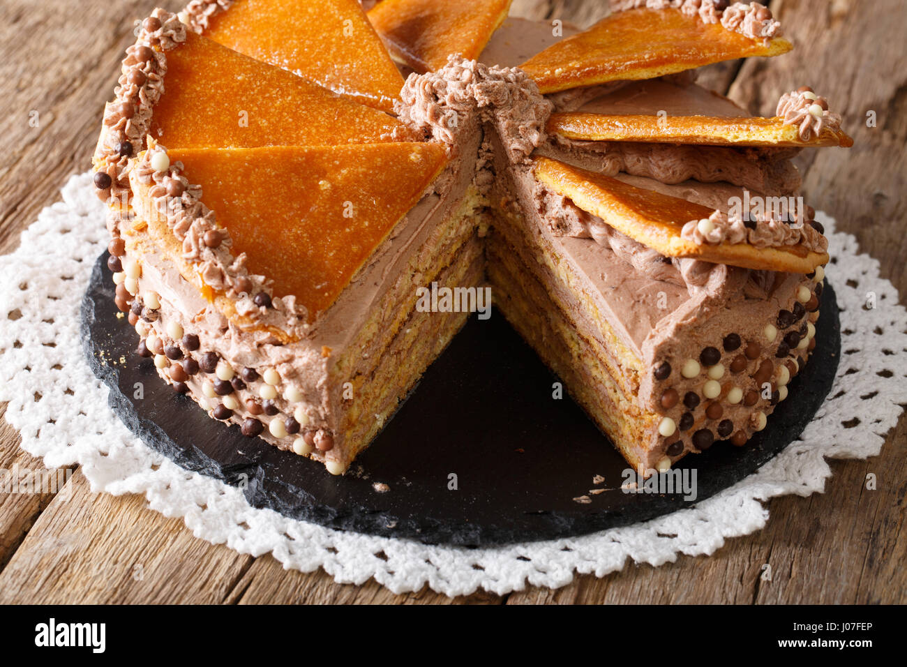 Sliced Hungarian Dobosh cake closeup on the table. horizontal Stock Photo