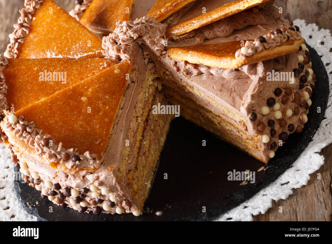 Cut Dobos cake close-up on the table. horizontal Stock Photo