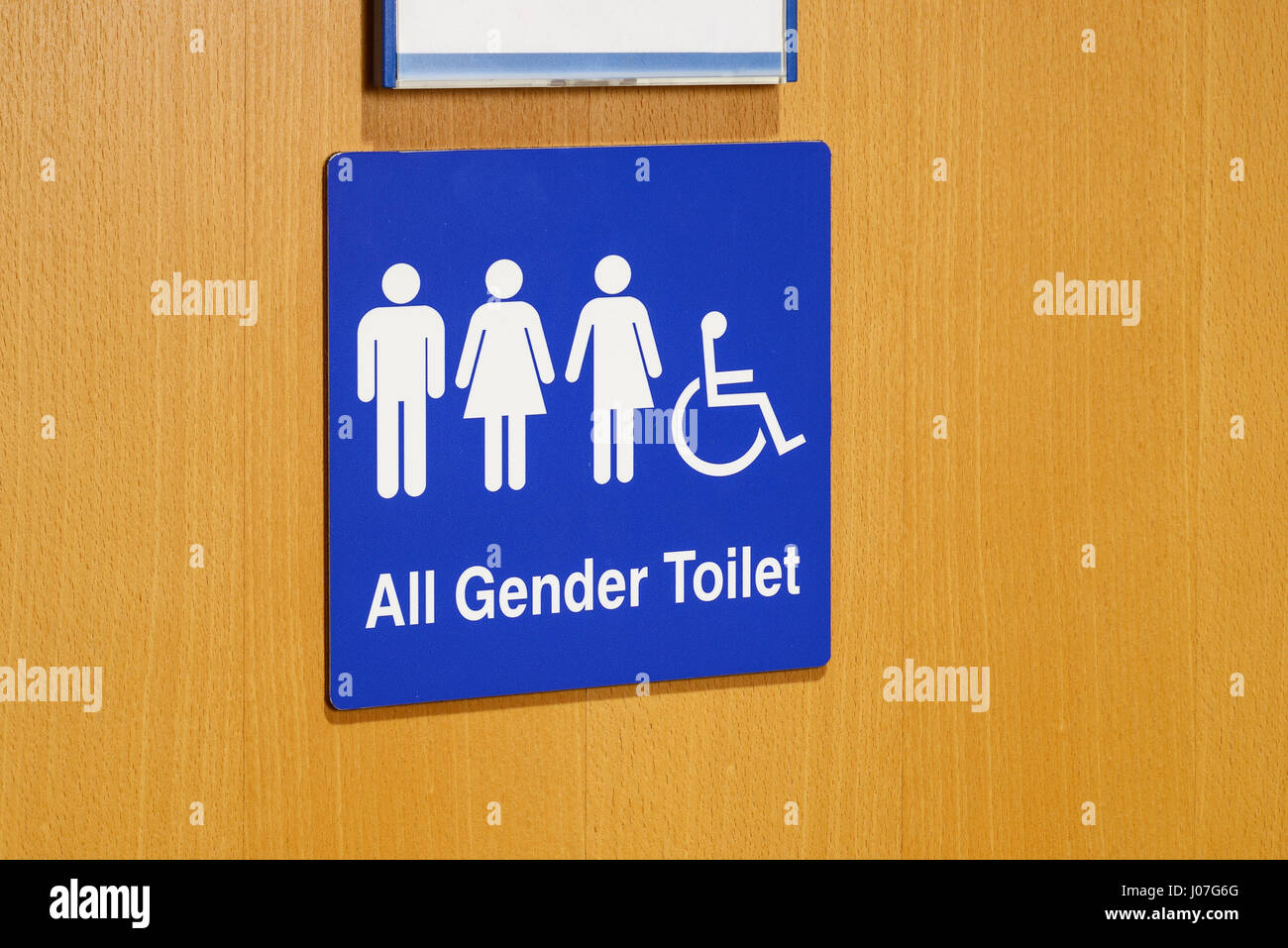 An All Gender Toilet sign on a door Stock Photo