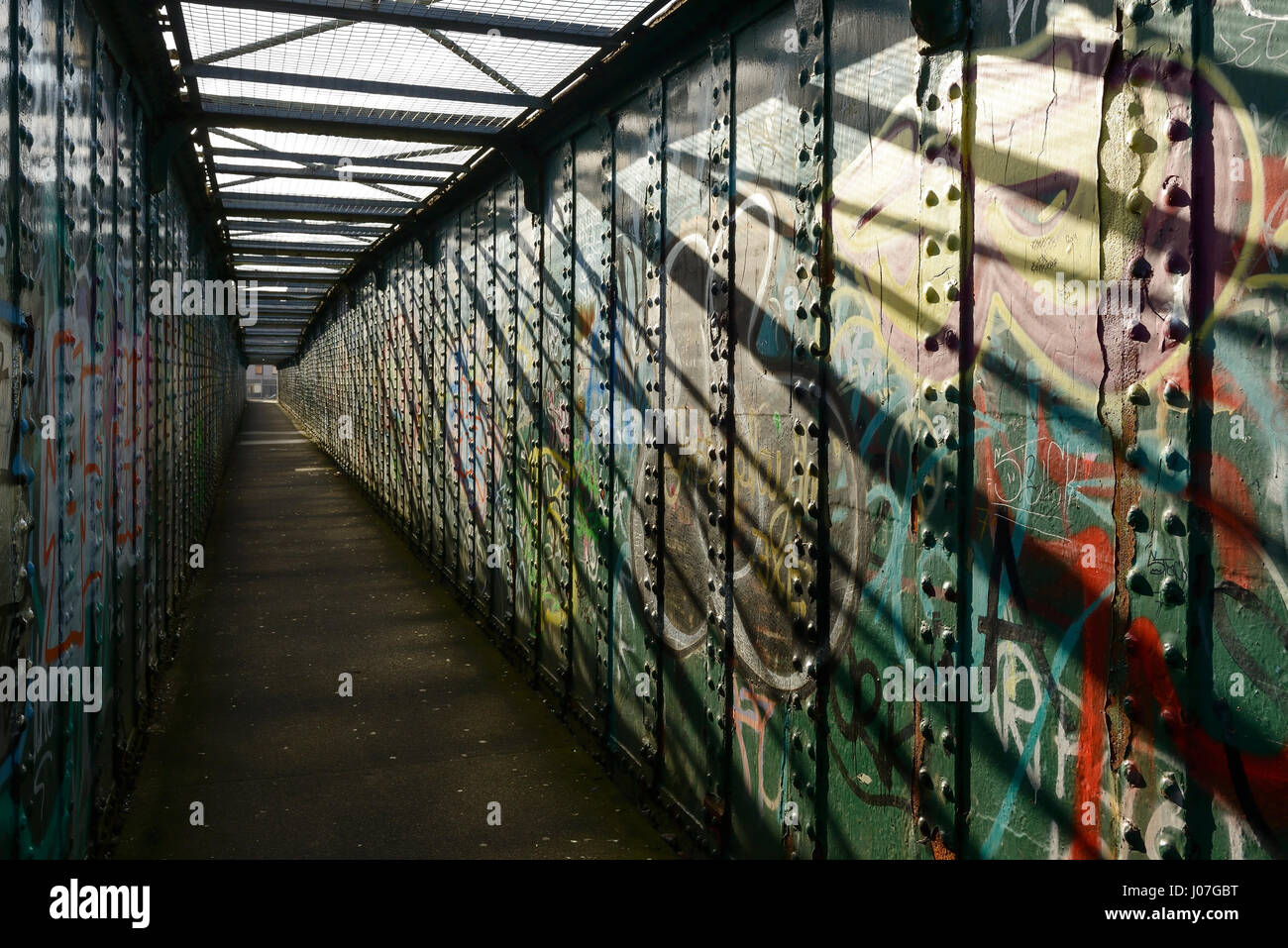 Pedestrian walkway covered in graffiti in Sheffield city centre uk Stock Photo