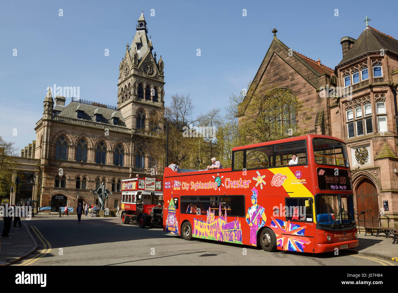 Two sightseeing tour buses outside Chester Town Hall UK Stock Photo
