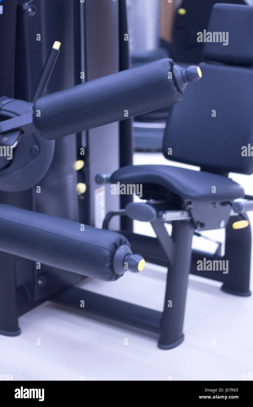 Leg weights extension for quadriceps and curl for hamstrings gym