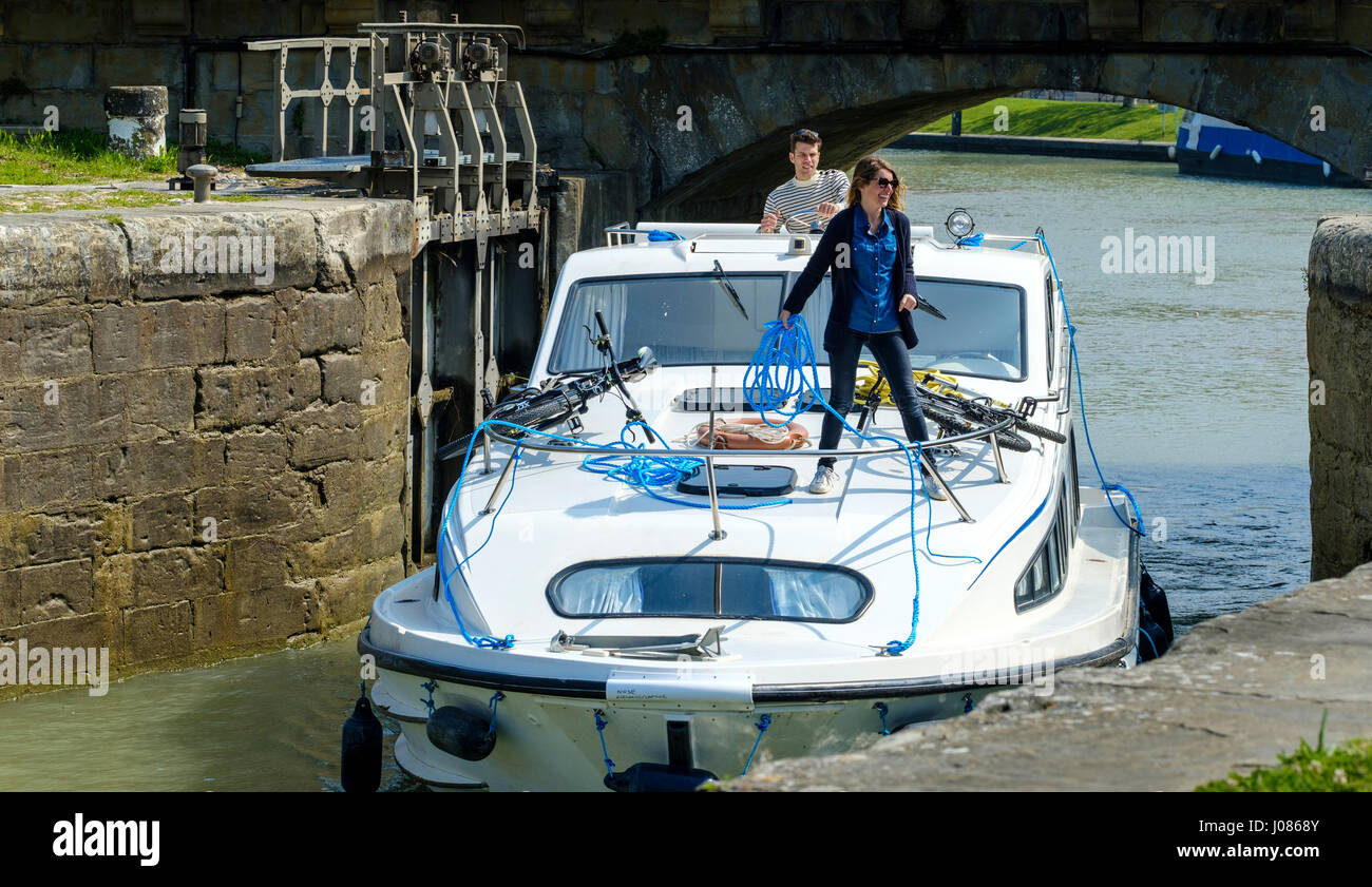 A cabin cruiser enters a lock on the Canal du Midi in Carcassonne