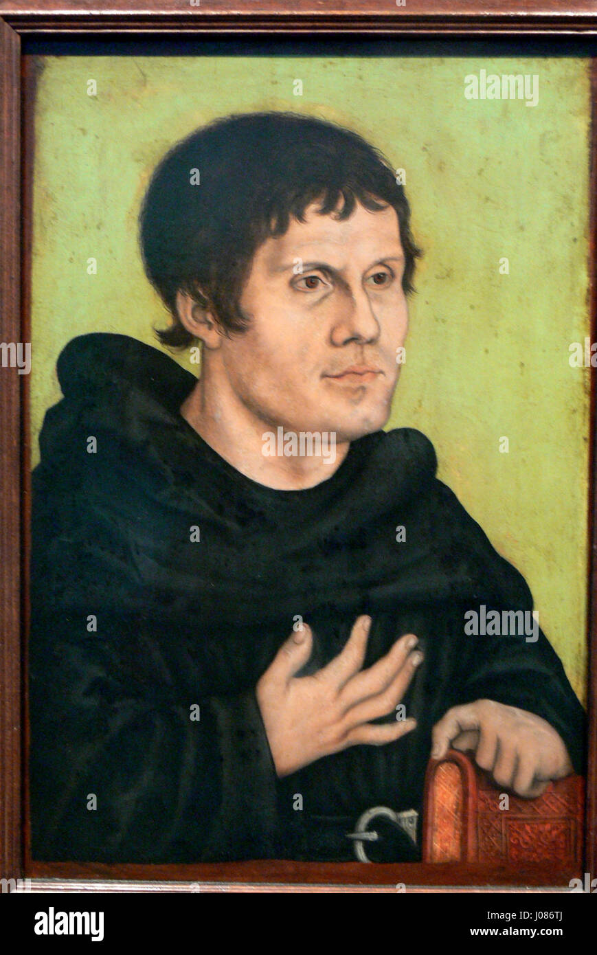 This image, titled 'Luther als Mönch,' represents Martin Luther as a ...