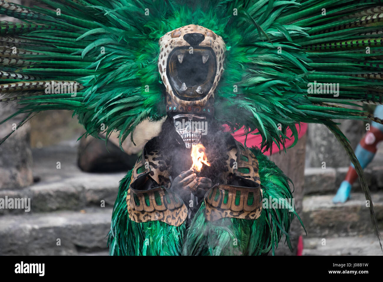 Cancun, Mexico - Mar 16, 2017: Handsome young man dressed in a traditional mayan jaguar costume. Stock Photo