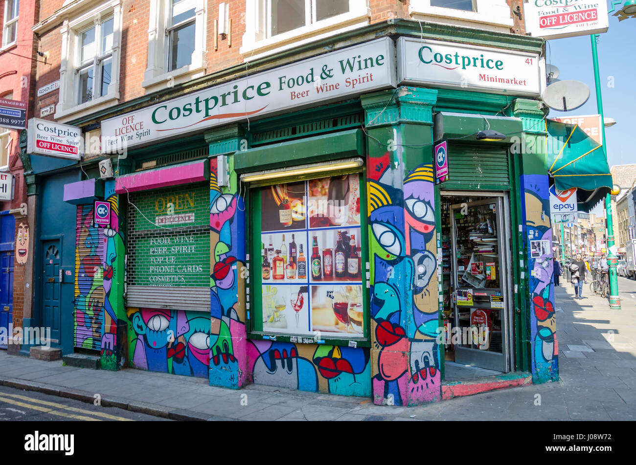 The Costprice convenience store on Brick Lane is decorated with colourful street art. Stock Photo