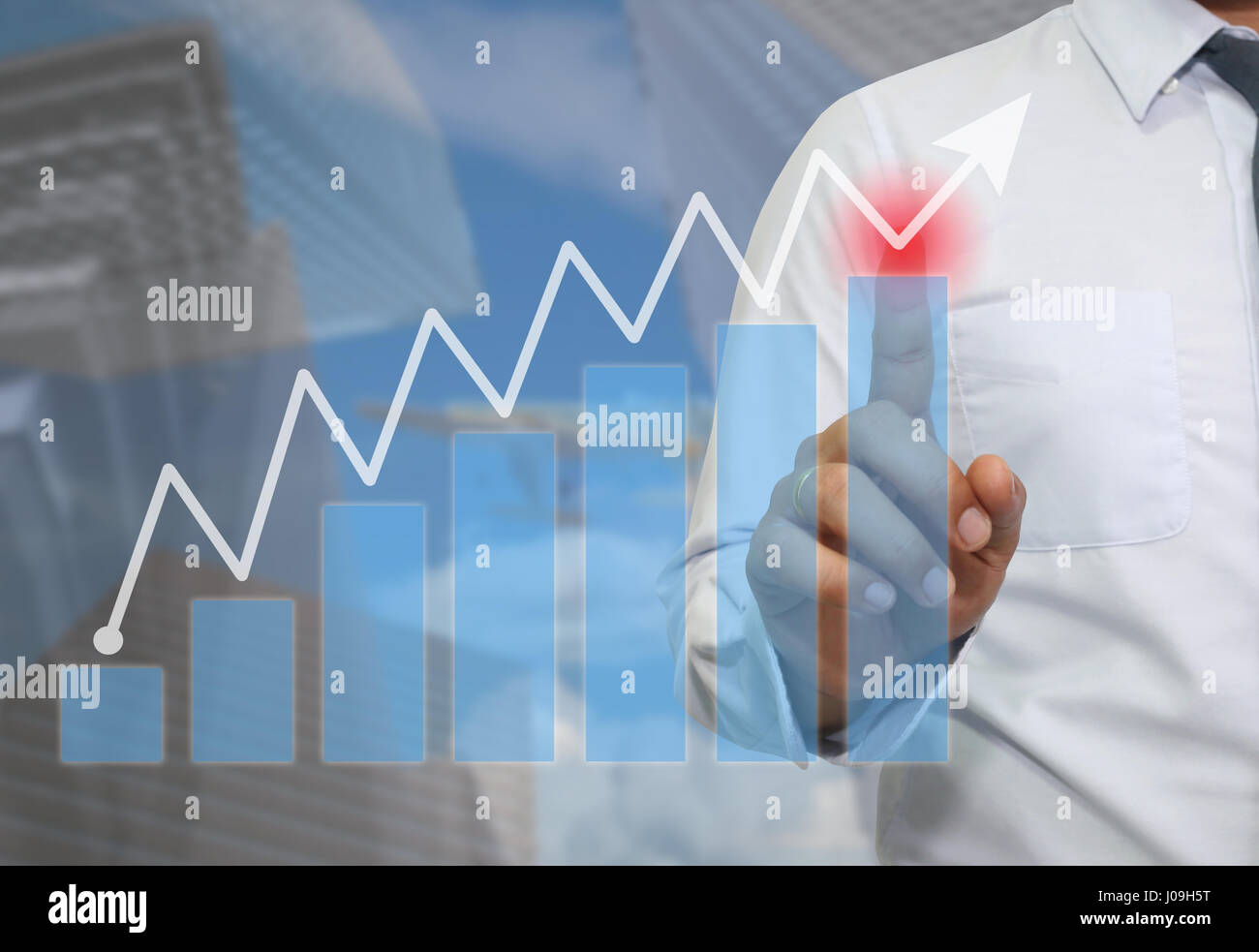 Hand of Businessman use finger pointing to the top of graph concept of ...