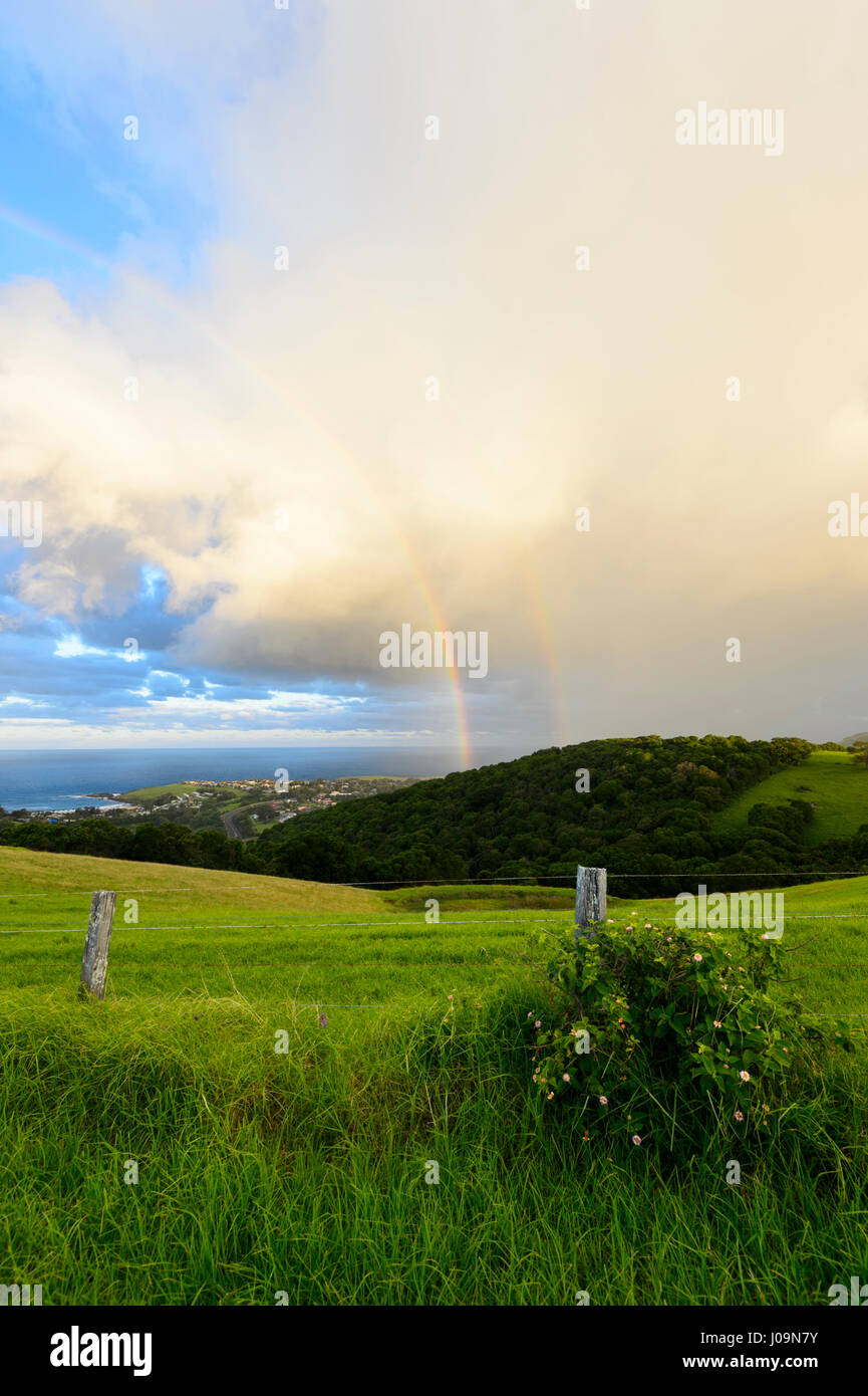 Stormy weather with double rainbow over Kiama, seen from Saddleback