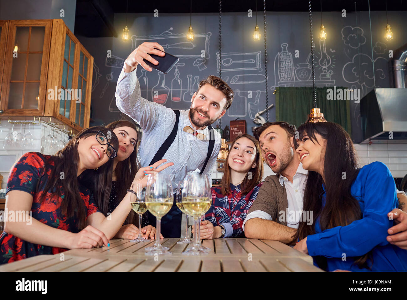 Friends do selfie on the phone at bar restaurant Stock Photo - Alamy