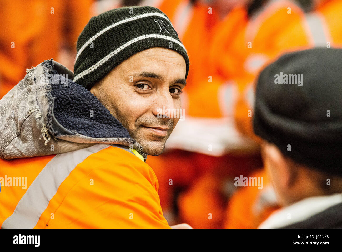 Construction workers waitin to start a night shift Stock Photo