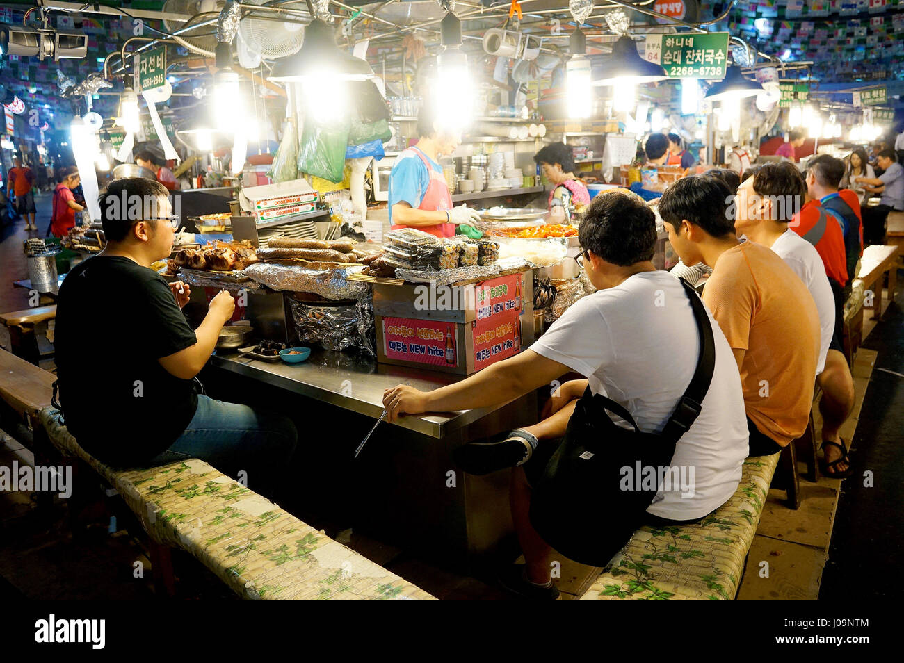 SEOUL, SOUTH KOREA - MARCH 20: Korean people eating at a street food