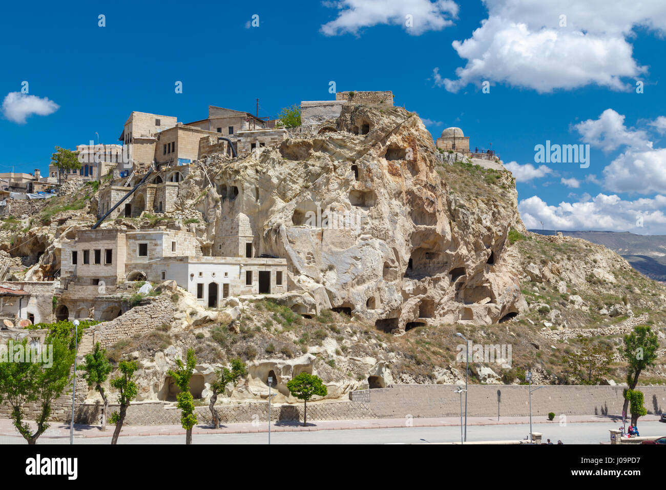 Landscape View Of Famous Historical Wish Hill With Sandstone Caves And Limestone Buildings On Bright Blue Sky Background Landscape View Of Famous Historical Wish Hill With Sandstone Caves And Limestone Buildings On Bright Blue Sky Background