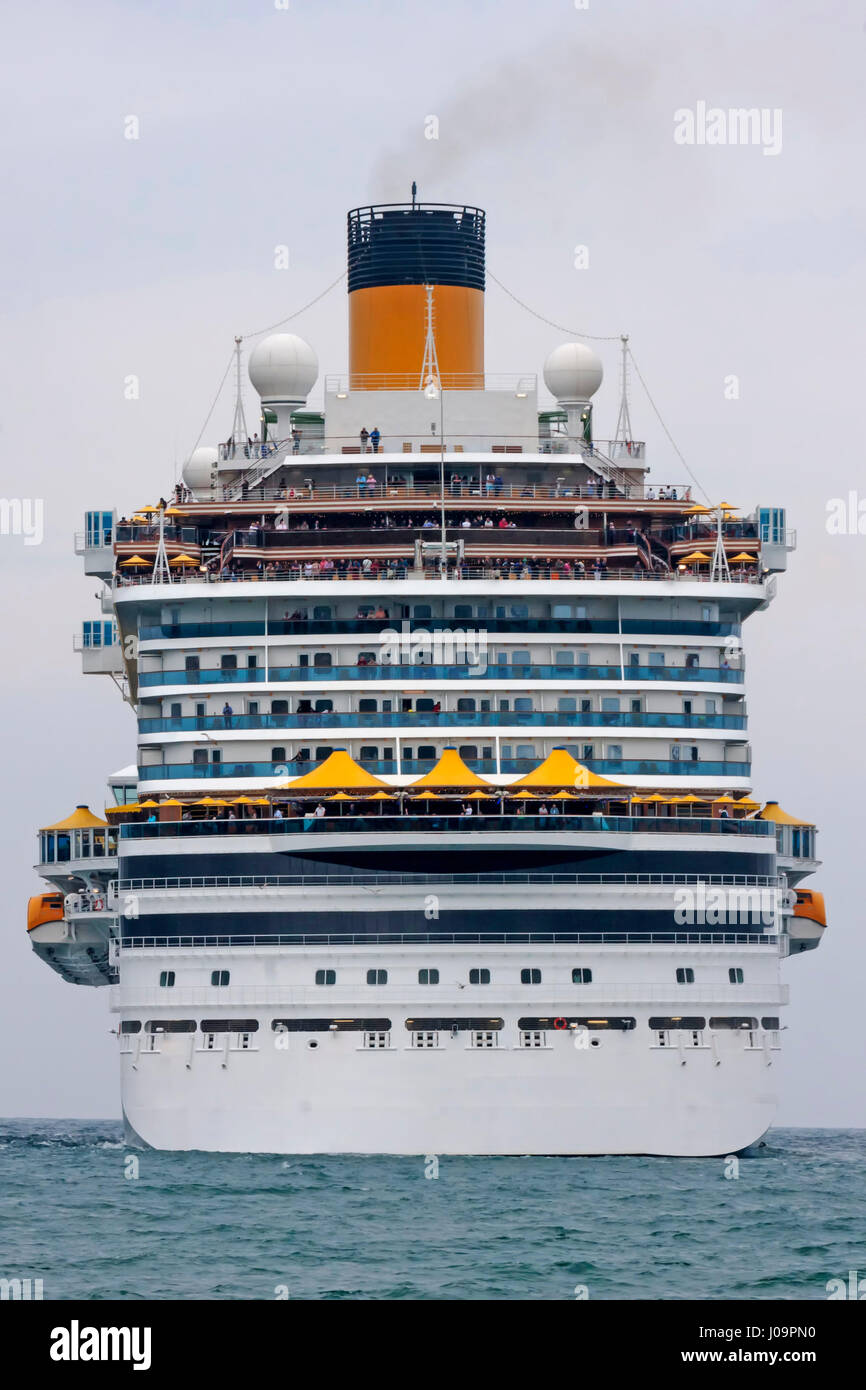 Cruise ship go away on the ocean Stock Photo