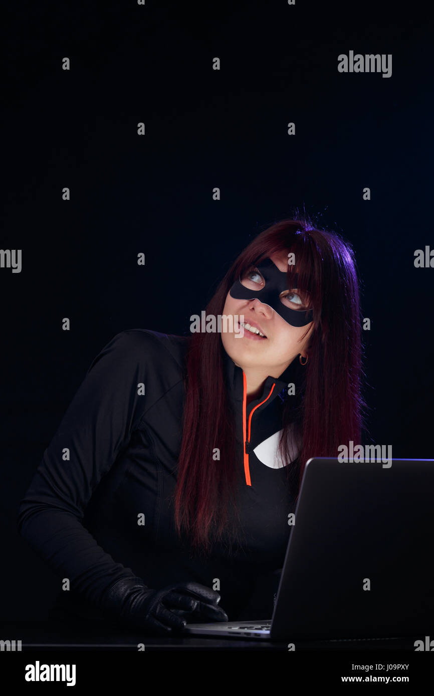 Female hacker in black mask hires stock photography and images Alamy