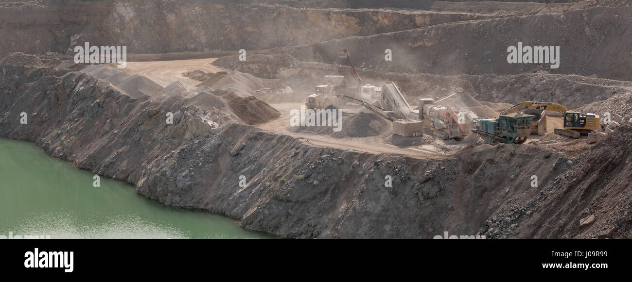 Quarrying and processing operations at Wick Quarry. Machinery engaged in limestone aggregate mining and crushing near Bristol, in Wiltshire Stock Photo