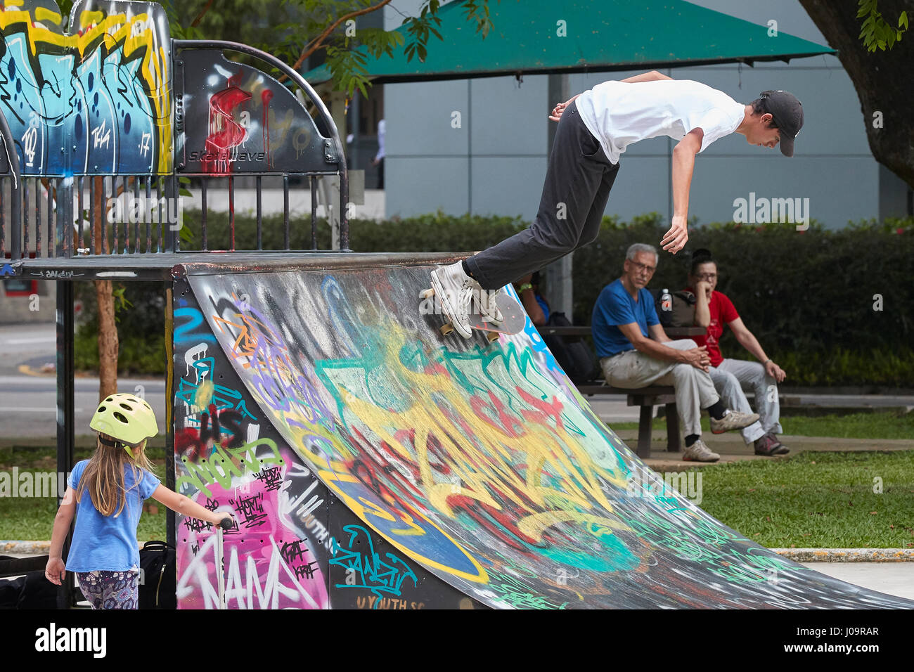 Young Asian Man Skateboarding In The SCAPE Skate Park, Singapore Stock  Photo - Alamy