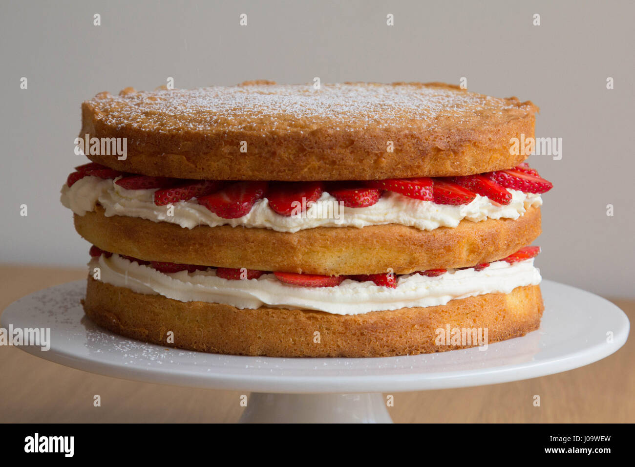 Victoria Sponge Cake with Whipped Cream and Strawberry Stock Photo