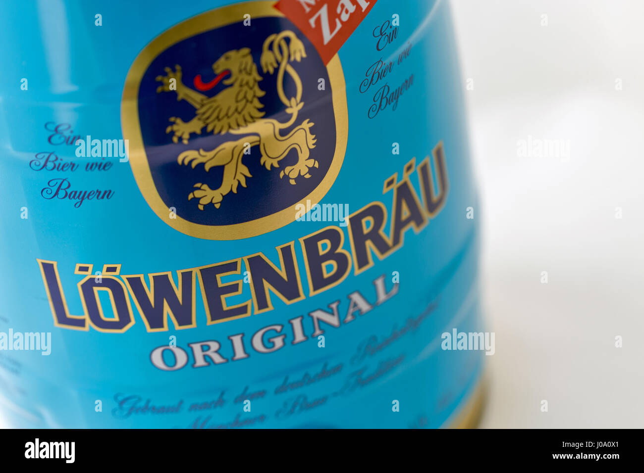 KIEV, UKRAINE - APRIL 17, 2016: Lowenbrau small barrel of beer can closeup against white with copy space. Lowenbrau is a brewery founded in Munich aro Stock Photo