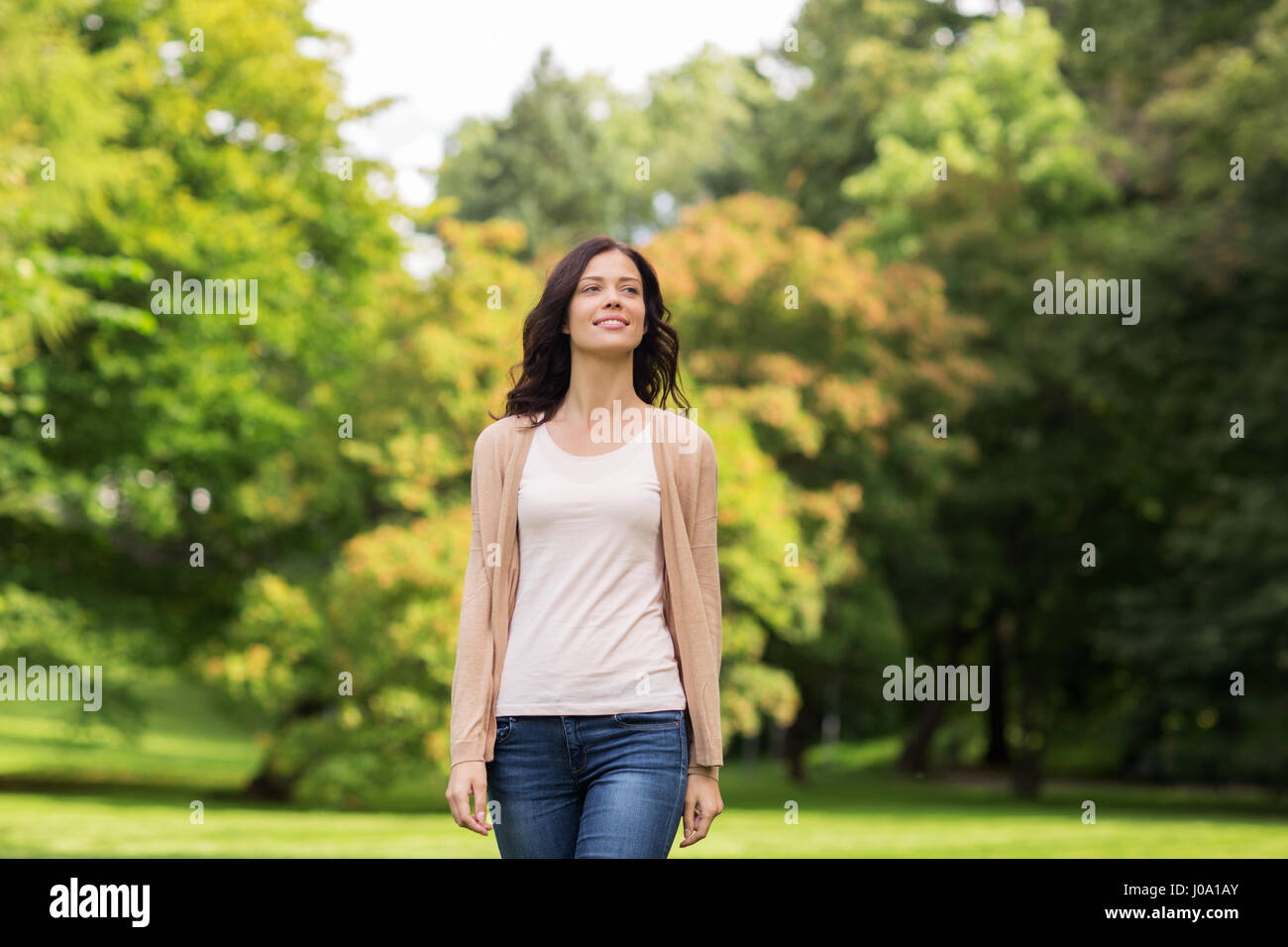 beautiful happy young woman in summer park Stock Photo - Alamy