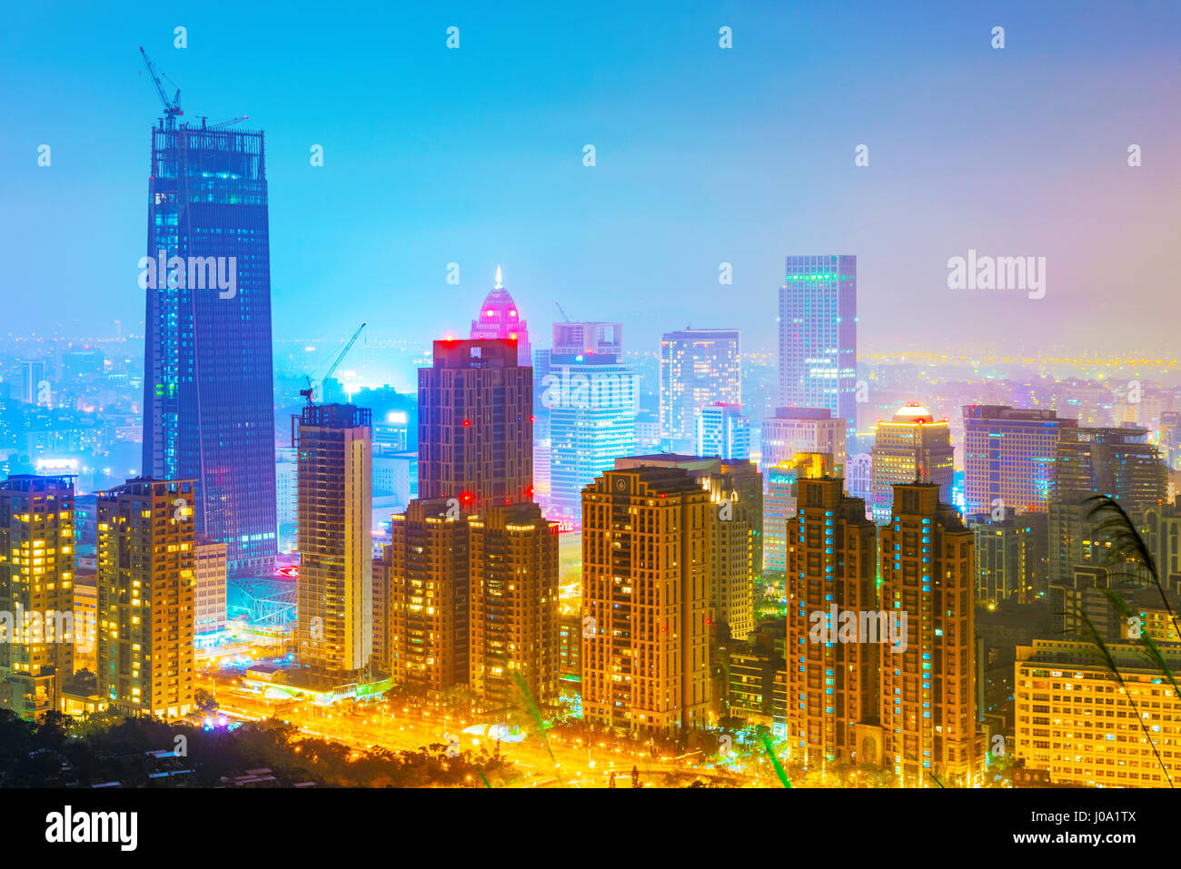 TAIPEI, TAIWAN - MARCH 20:  This is a view of Xinyi financial district skyscrapers and high rise buildings at night on March 20, 2017 in Taipei Stock Photo