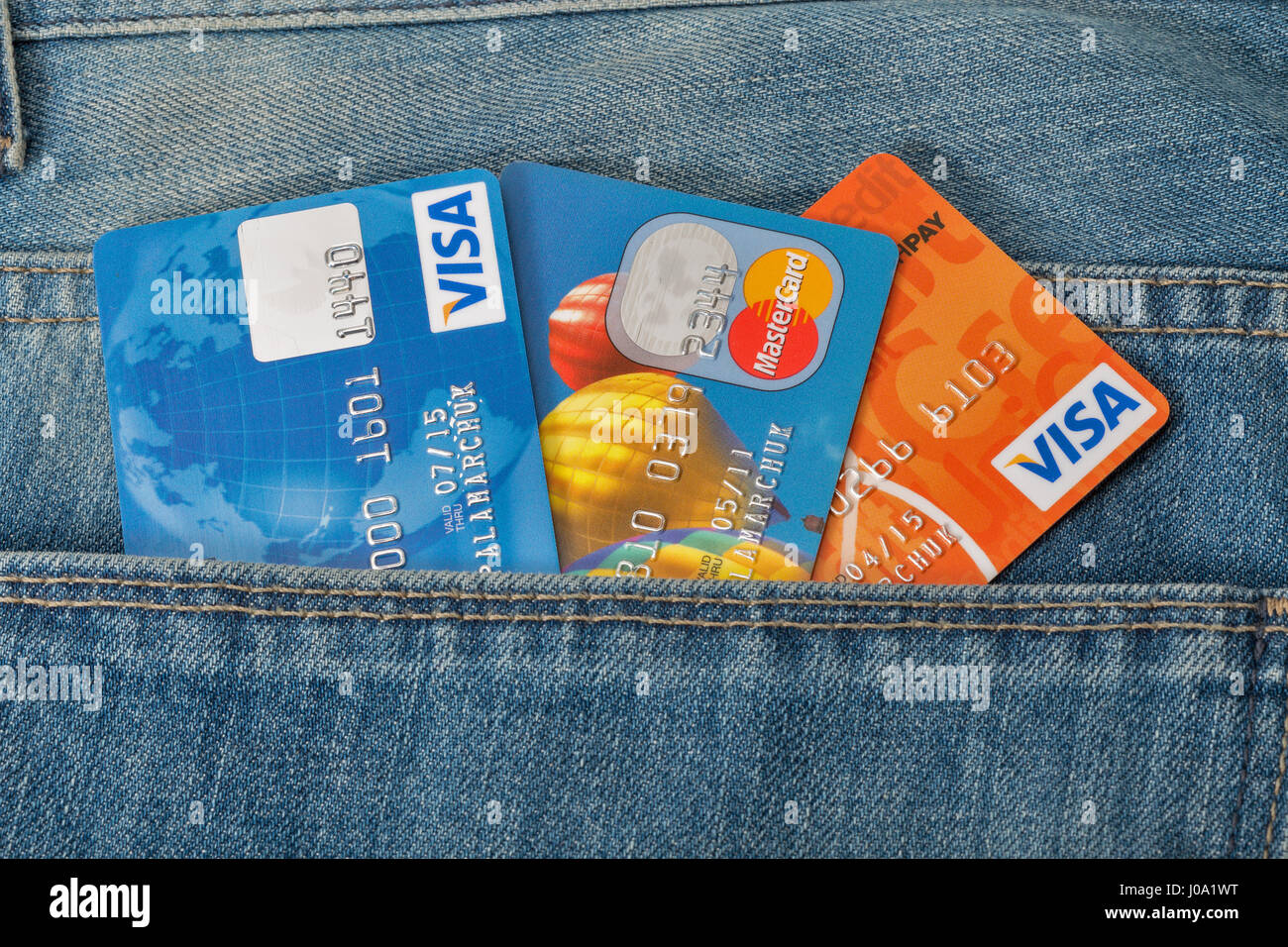 KIEV, UKRAINE - AUGUST 09, 2016: MasterCard and Visa credit cards in back  pocket of blue jeans closeup. Mastercard and Visa is an American  multination Stock Photo - Alamy