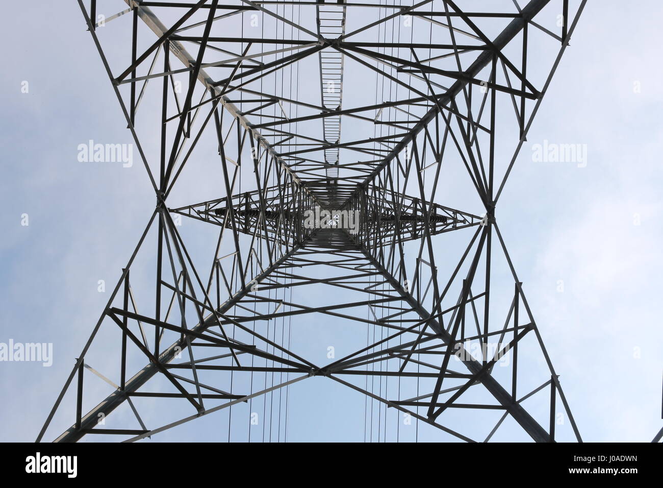 High Voltage Poles in Bottom View. Stock Photo