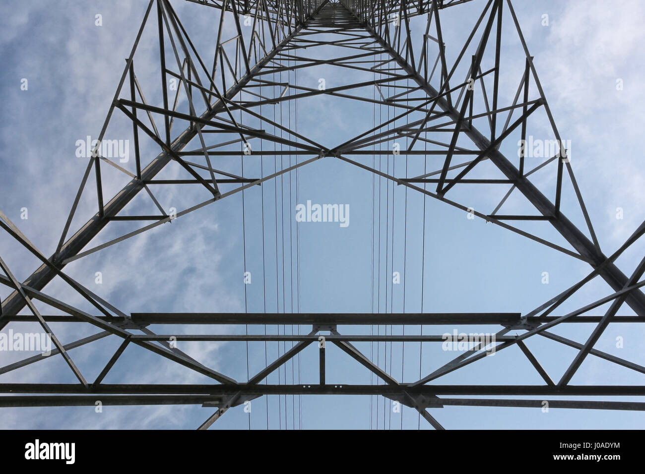 High Voltage Poles in Bottom View. Stock Photo