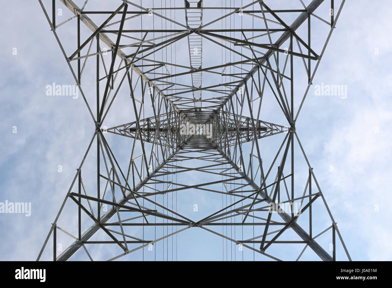 High Voltage Poles in Bottom View. Stock Photo