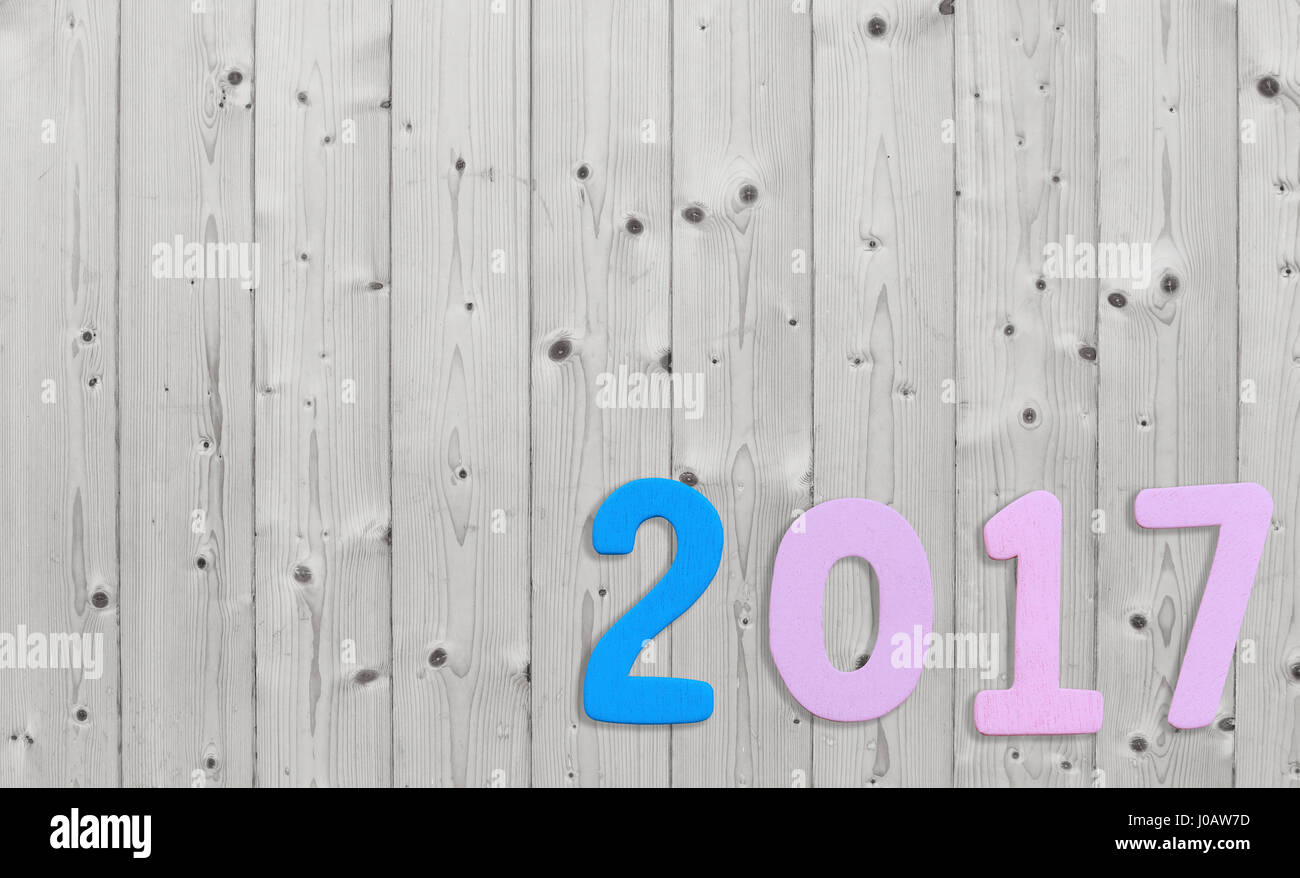 Number of 2017 on a white wood background in concept of the New Year ...