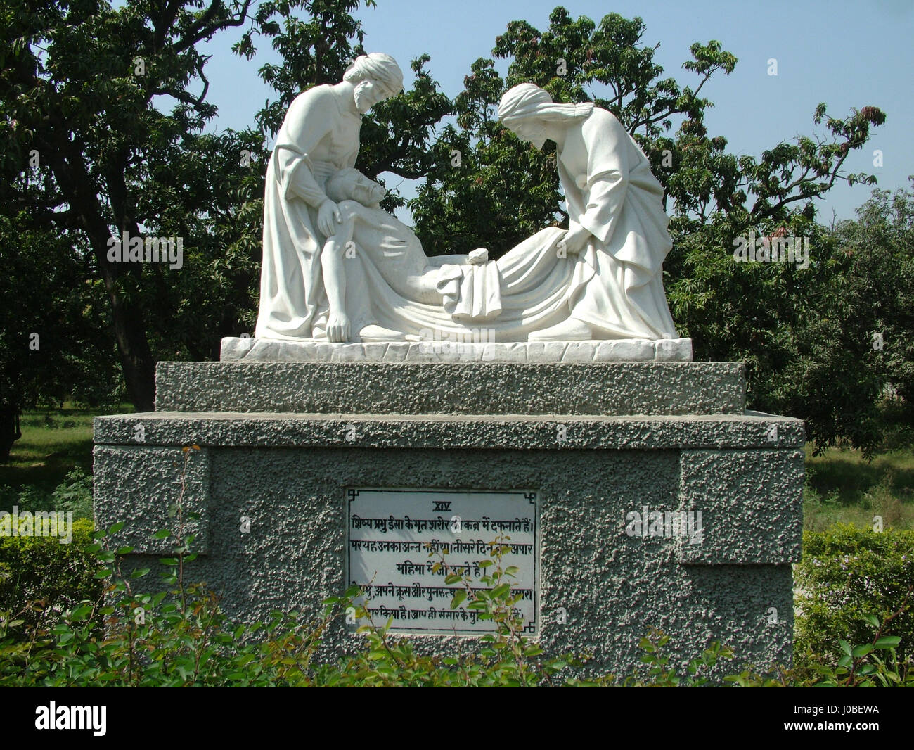 Statue: Fourteenth Station, Jesus is laid in the tomb. Basilica of Our Lady of Graces, Begum's Church, Sardhana (Copyright © by Saji Maramon) Stock Photo