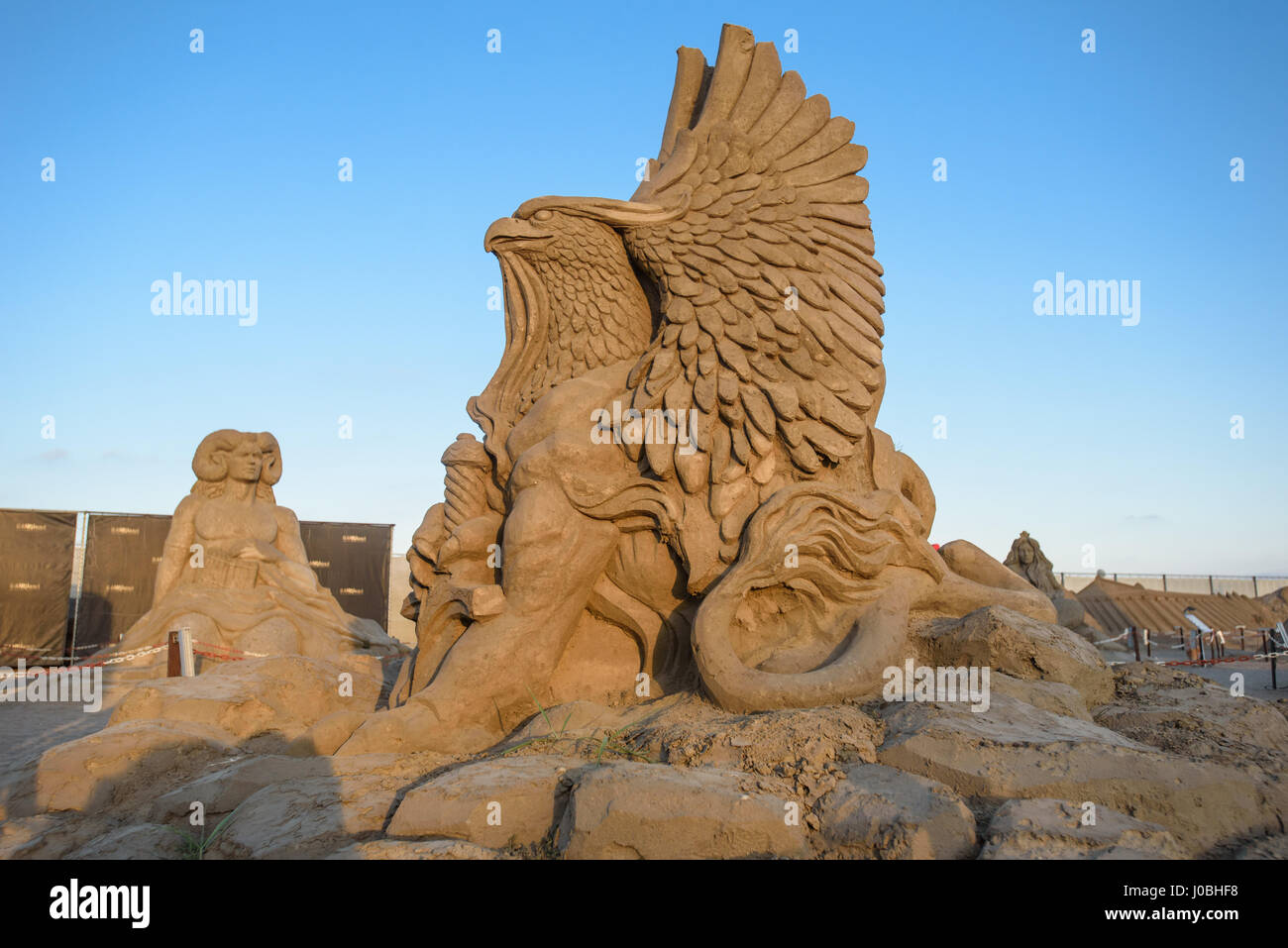 Griffin. ANTALYA, TURKEY: FROM the Pyramids of Egypt to mighty Viking god Thor these amazing works of art that are made from just sand and water. The theme of this year’s from Antalya International Sand Sculpture Festival is the ‘Seven wonders of the world and mythology’ and the spectacular sculptures include the Taj Mahal, The Sphinx and the Inca Pyramids. Other sculptures include mythical gods from a range of ancient cultures including Neptune from Greece, Thor from the Vikings and Horus from Ancient Egypt. Once night falls the sculptures are lit up by a colourful lighting system. The pictur Stock Photo