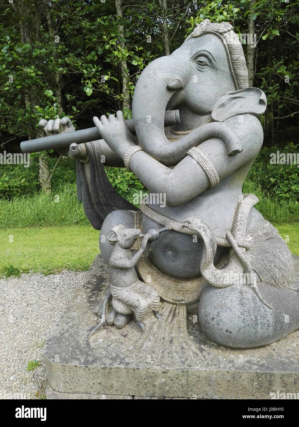 ROUNDWOOD, IRELAND: QUIRKY images have revealed the oddball figures that litter a long-forgotten sculpture park that lies off the beaten track. The haunting pictures show a statue of a man pulling a dagger out of himself while his head splits in two while another looks over the scene with hollow, soulless eyes. Other shots show the Hindu god Ganesha playing a variety of instruments, a woman trying to escape a huge clawed hand and even a suited mouse drinking a pint of ‘Genius’. The spooky snaps were taken at Indian sculpture park, Victor’s Way, in Roundwood, Ireland by writer Debra Kelly (37)  Stock Photo