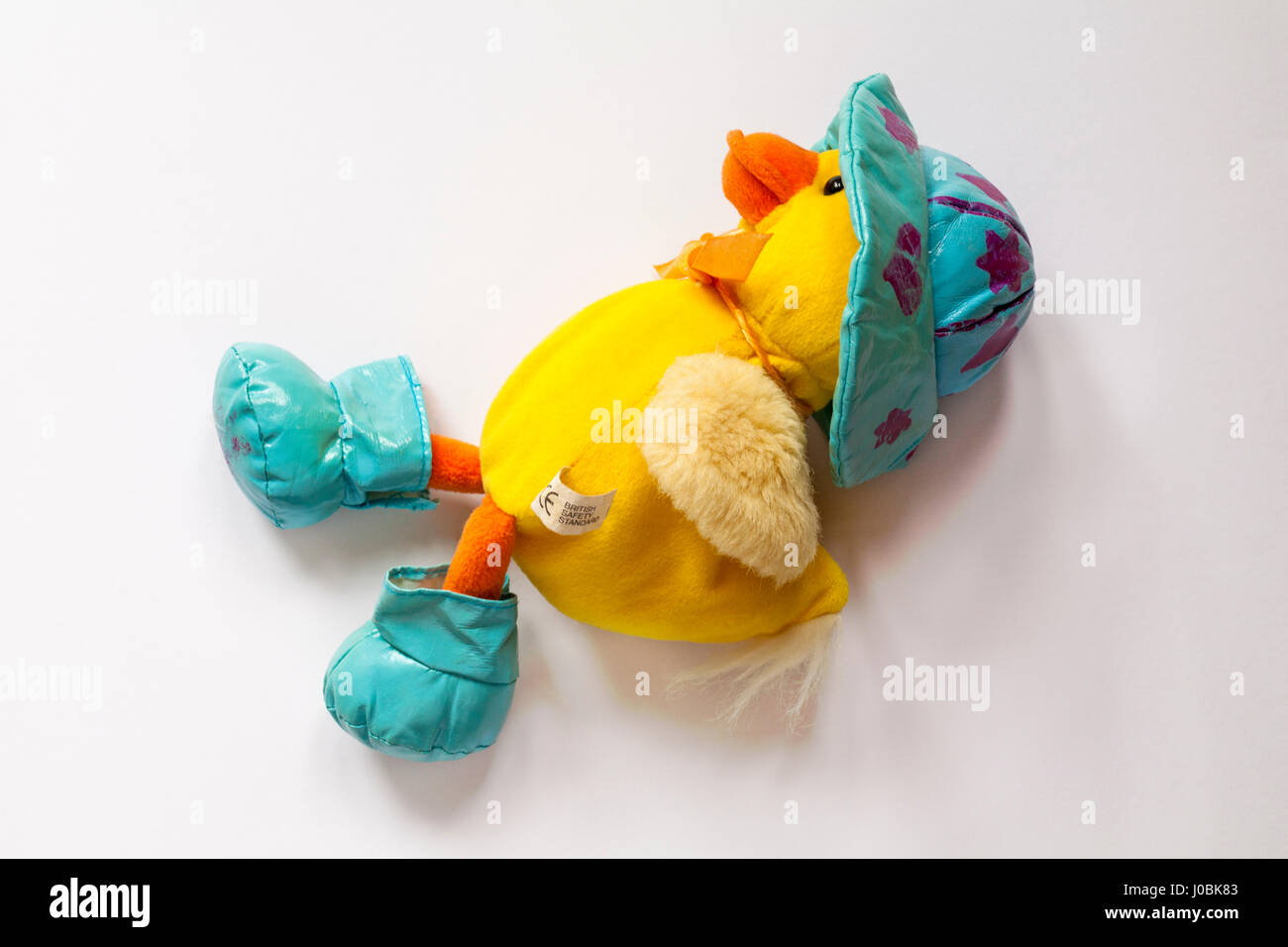 Duck with wellies and rain hat soft cuddly toy isolated on white background Stock Photo