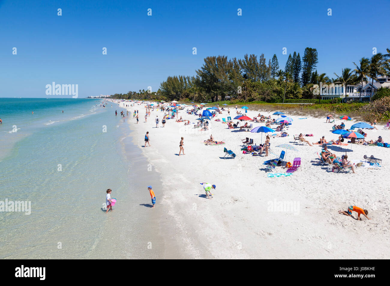 Naples, Fl, USA - March 18, 2017: Beautiful white sand beach at the Gulf of Mexico coast in Naples. Florida, United States Stock Photo